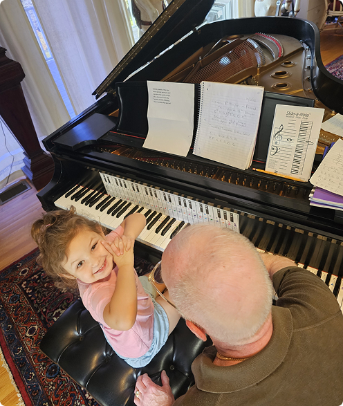 Daniel Teaching Maddie Piano